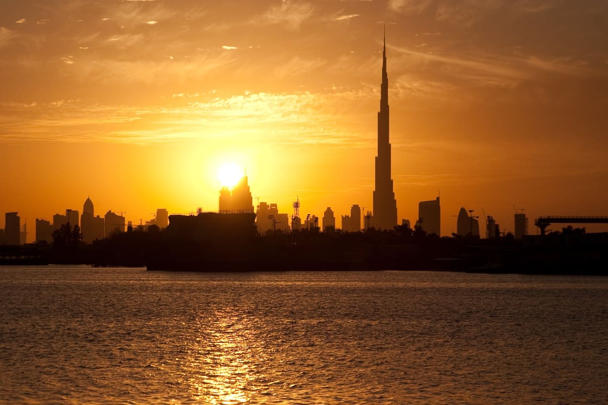 The Burj Khalifa silhouetted against a Dubai sunset